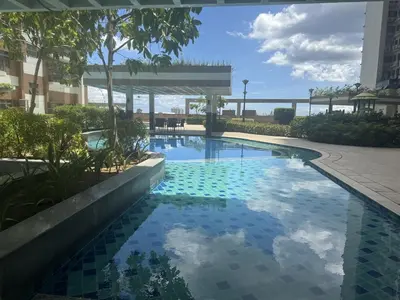 a swimming pool in the middle of a building at Levi & Moon's Chill with beautiful view in Manila