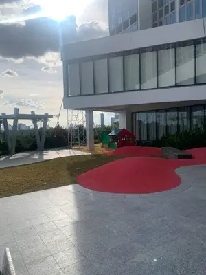 a red carpet in front of a building at 2 bedroom Luxury Condo in Eastwood with Scenic City view, unli wifi and netflix in Manila