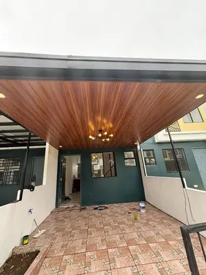 an entrance to a building with a wooden ceiling at A peace and quiet home away from your home in Calamba