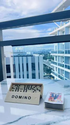 a game controller sitting on a table in front of a window at L A Azure staycation in Manila