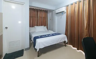 a small bedroom with a bed in a room at VCloud Hills Boarding House Near NAIA Terminal in Manila