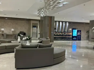 a lobby with couches and a bar in a building at jastmypads and staycation in Manila