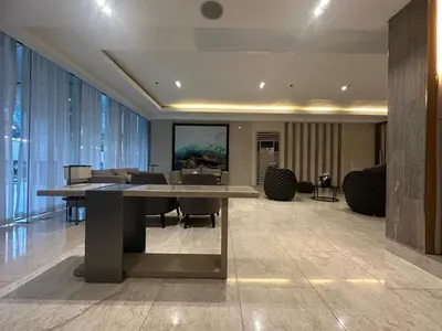 a meeting room with a table and chairs in a building at jastmypads and staycation in Manila