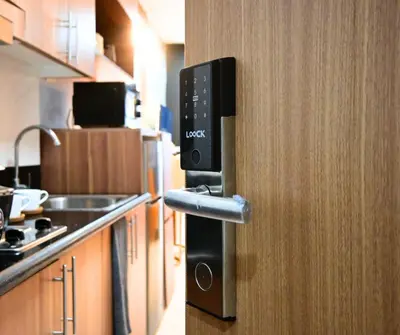 a doorhandle to a kitchen with a kitchenasteryasteryasteryasteryasteryasteryastery at Chic & Cozy Urban Stay in Manila