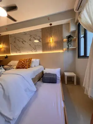 a room with two beds in a room at Condo Living at Shore with Parking in Manila