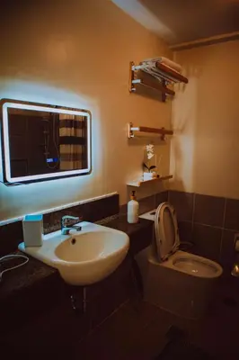 a bathroom with a sink and a toilet at Cozy 1BR Staycation at Satori Residences, Pasig in Manila