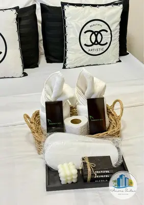 a basket of spa items on a bed at Azure Urban Resort Residences by Amóre Suites in Manila