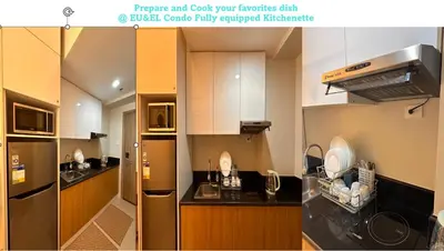 a kitchen with white cabinets and a stainless steel refrigerator at Eu & El Cozy Condo in Manila