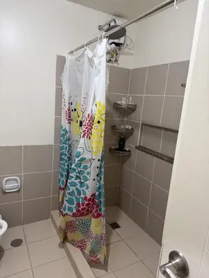 a shower curtain in a bathroom with at fairlane residences in Manila
