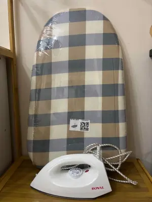 a white phone sitting on a table with a surfboard at Dainty Den LF508 - Comfy & Chic Home beside Enchanted Kingdom in Santa Rosa