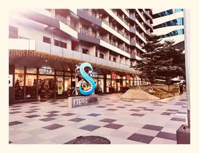 a building with a sign in the middle of a courtyard at S Residences Tower 2, 1 Bedroom in Manila