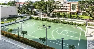 a tennis court in the middle of a city at 1BR LaVerti Cloud Nine Suite Family Affordable Staycation in Manila