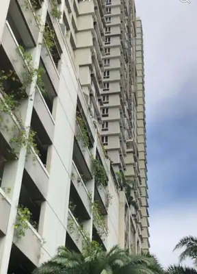 an apartment building with plants on the side of it at 1BR LaVerti Cloud Nine Suite Family Affordable Staycation in Manila