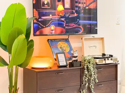a room with a dresser with a picture on the wall at Prime BGC 1BR Near Grand Hyatt & Malls #upt215e in Manila
