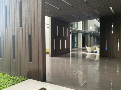 a hallway of a building with a wooden wall at Gentry Manor 1BR with Balcony Near Okada - 6A in Manila
