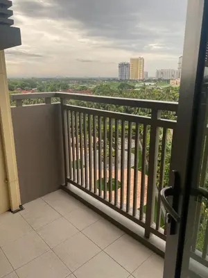 a balcony with a view of a city at Gentry Manor 1BR with Balcony Near Okada - 6A in Manila