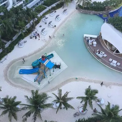 an aerial view of a water park with a water slide at Azure Luxe Suites in Azure Bicutan Near NAIA and MOA in Manila
