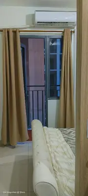 a bedroom with a bed and a large window at 1BR Amenity View Room at Shore Residences, Pasay Near MOA & Airport in Manila