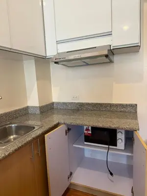 a kitchen with a sink and a counter top at Cypress 108 in Manggahan