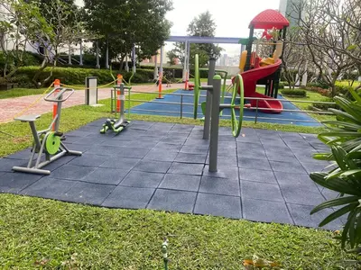 a park with a playground with a slide and swings at Jazz Tower A Cozy Room for 2 Adults in Manila