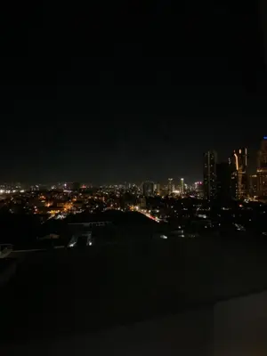 a view of a city at night at Jazz Tower D Superb view with Queen Bed in Manila
