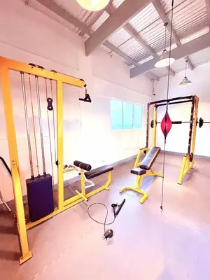 a room with a gym with a treadmill and a simulator at Minimalist Condo near NAIA Free Netflix Pool Balcony in Manila