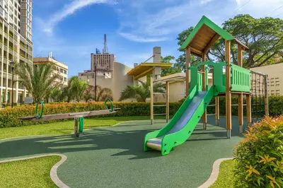 a playground with a slide in a park at La Verti Residences 1520 in Manila