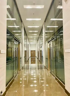 an empty hallway in a building with glass walls at Urbanstay at The Radiance Manila Bay in Manila