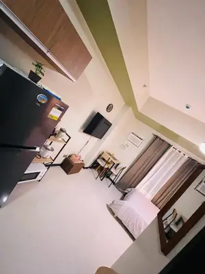 an overhead view of a room with a bed and a television at Urbanstay at The Radiance Manila Bay in Manila