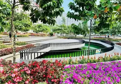 a park with a bench and some flowers at Kage-no-Wa Suite Netflix, Disney, HBO 2BR in Manila