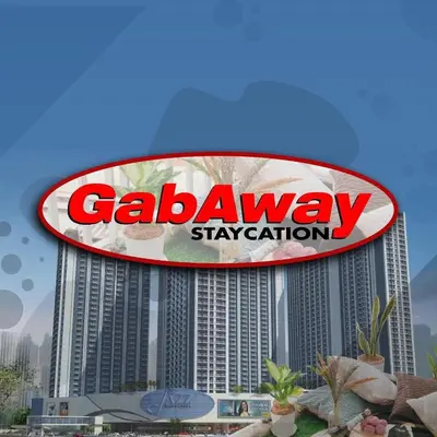 a large sign on top of a building at SM Jazz Residences, Makati City in Manila