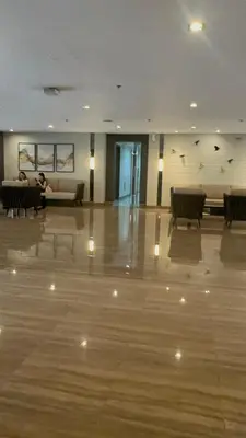 a large room with a couch and a table in it at The Dream Scape SMDC Air Residences Makati in Manila