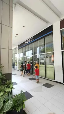 a group of people standing outside of a building at Manila Airport Hub near NAIA T3 -101 Newport Boulevard in Manila