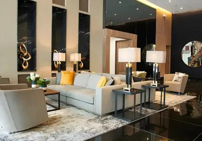 a living room with a white couch and chairs at The Urban Crib SMDC Residences Makati in Manila