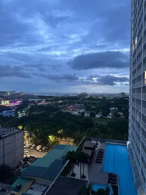 a view of a swimming pool from a building at Sweet Villa SMDC Breeze Residences Pasay in Manila