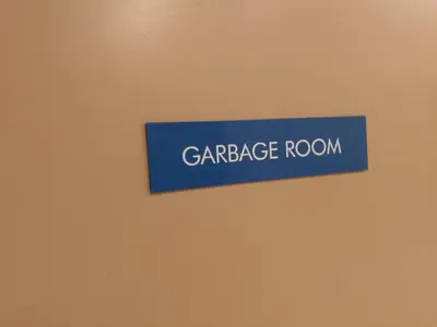 a blue sign that reads carriage room on a wall at S Residences Tower 1 - near MOA & Ayala Malls Manila Bay in Manila