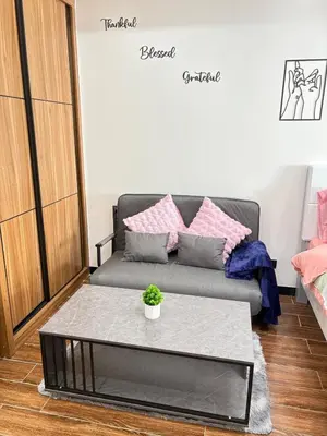 a living room with a couch and a table at Sy bay Suites TwinBed near Okada MOA PITX NAIA cod MSV1502H in Manila