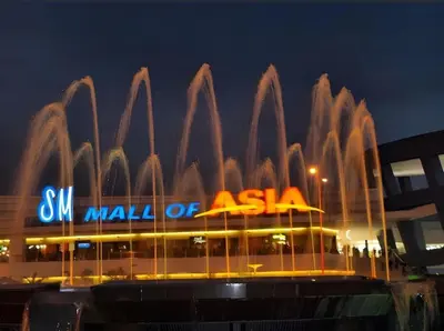 a building with a water fountain in front of it at Sy bay Suites Okada NAIA T3 T1 Airport MOA COD DFA MSV1506H in Manila