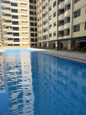 an empty swimming pool in front of buildings at Sy bay Suites Okada NAIA T3 T1 Airport MOA COD DFA MSV1506H in Manila