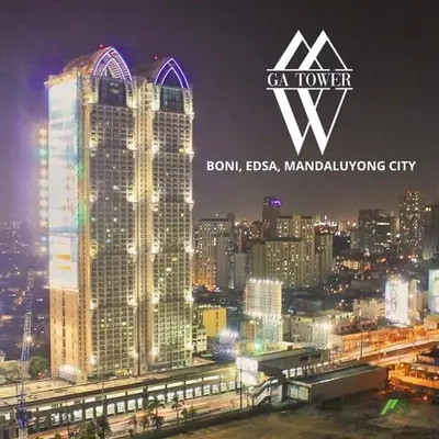 a view of a city skyline at night at Whereabouts Midway Condotel in Manila