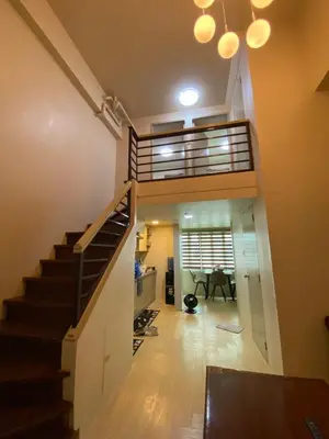 a view of a staircase in a house at Whereabouts Midway Condotel in Manila