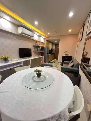a living room with a white table and chairs at Staycation Near Mall of Asia in Manila