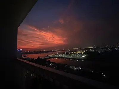 a view of a city at night with a red sky at E&T staycation in Manila
