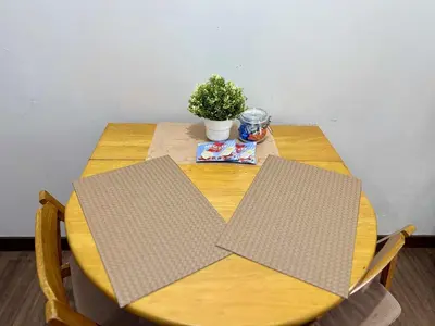 a wooden table with a plant on top of it at 1BR Minimalist Family Staycation in Manila