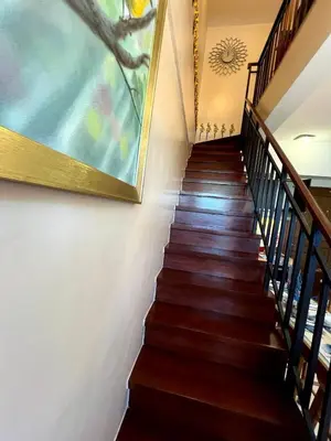 a stairway with a painting on the wall at Osaka Japan Theme Greenbelt Glorieta Makati Big Unit Loft 50sqm Free Pool Gym Netflix in Manila