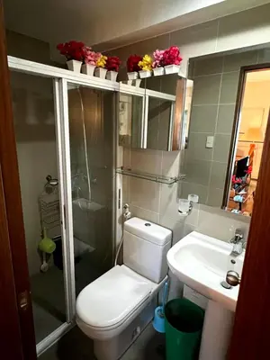 a bathroom with a toilet and a sink and a shower at Osaka Japan Theme Greenbelt Glorieta Makati Big Unit Loft 50sqm Free Pool Gym Netflix in Manila