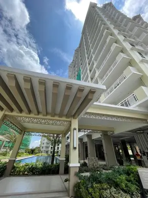 a large white building with a pergola at J Suite in Manila
