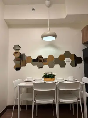 a dining room with a table and chairs at 1BR Luxury Apartment The Camden Place in Manila