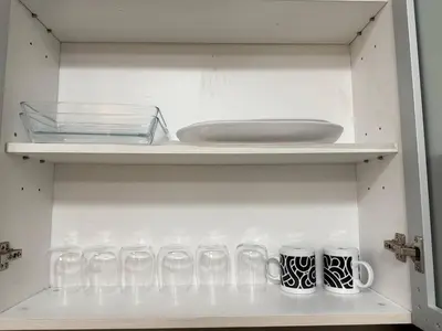 a row of glasses on a shelf in a refrigerator at European Vibe 1BR Great River City View Free Pool Gym Internet Netflix in Manila