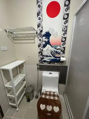 a bathroom with a painting of a wave on the wall at Japan Vibe near Ayala Feliz Mall 2BR 55sqm with Veranda Netflix Pool in Manila